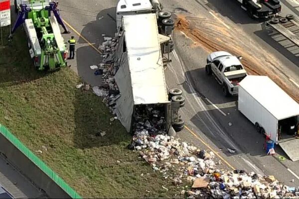 Massive 18 Wheeler Overturns on I 20 in Dallas, Spills Trash Across Highway