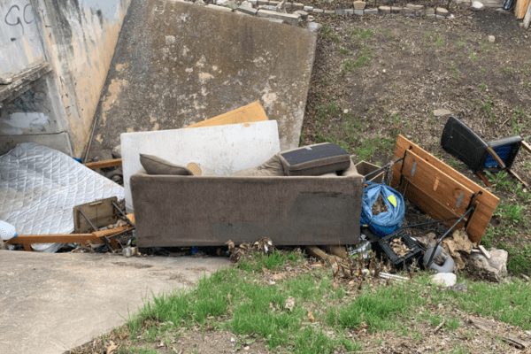 Austin Resident Frustrated as City Fails to Clean Up Creek Overflowing with Dumped Furniture
