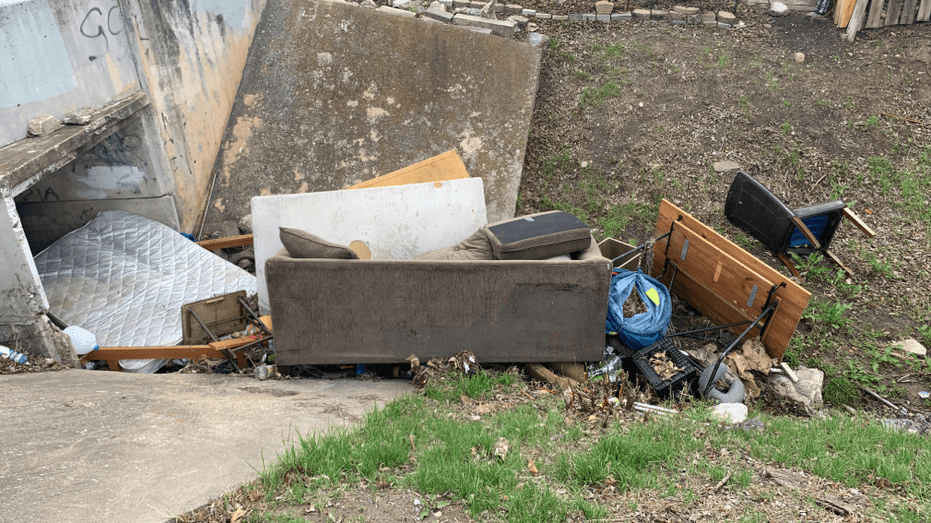 Austin Resident Frustrated as City Fails to Clean Up Creek Overflowing with Dumped Furniture