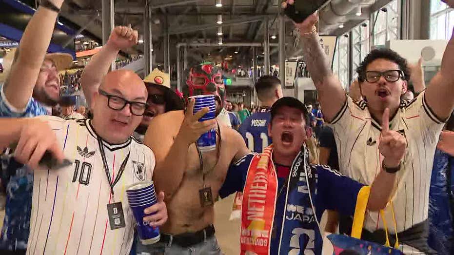 "Electric Atmosphere: Dutch and Japanese Fans Celebrate World Cup Draw at Dallas Stadium"