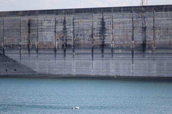 Low water levels at Lake Travis reveal various water level lines on Mansfield Dam on June 16, 2024.