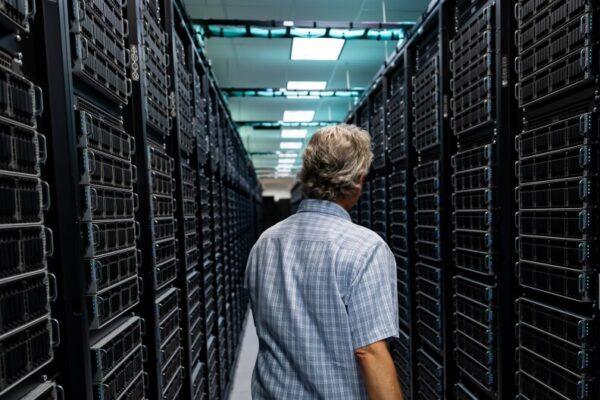 Tommy Minyard, with the Texas Advanced Computing Center, walks down an aisle of the data center on Thursday, March 26, 2026, in Austin, Texas.