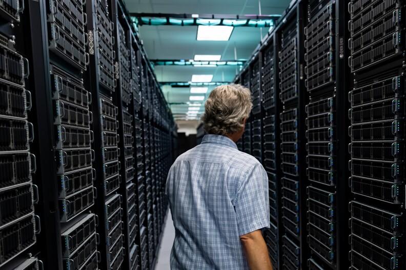 Tommy Minyard, with the Texas Advanced Computing Center, walks down an aisle of the data center on Thursday, March 26, 2026, in Austin, Texas.