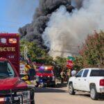 Massive Dallas Grass Fire Engulfs Home and Tires, Creating Dense Smoke Plume