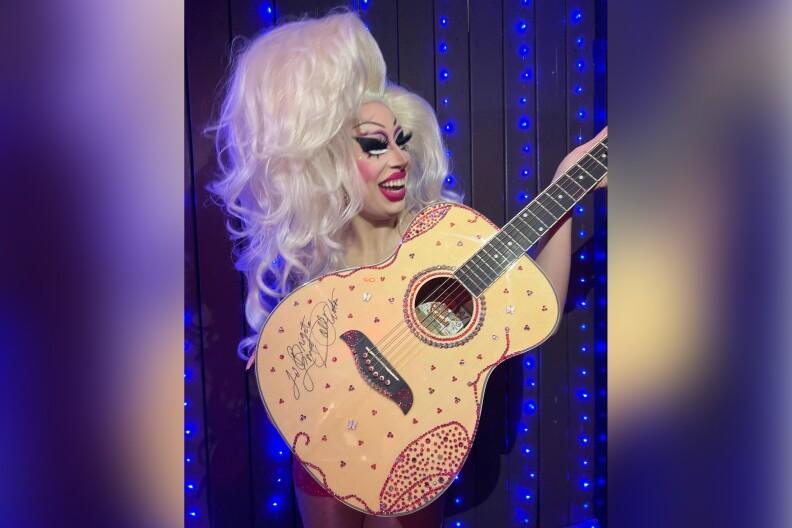 Dolly Parton Gifts Rhinestoned Guitar to Austin Drag Queen Brigitte Bandit: Here’s Why!
