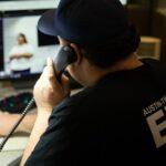 Clinical Specialist Greg Hinck, of the C4 clinical navigation team, fields priority five 911 calls on Sept. 13, 2023, at the Combined Transportation, Emergency, and Communications Center in Austin.