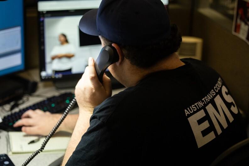Clinical Specialist Greg Hinck, of the C4 clinical navigation team, fields priority five 911 calls on Sept. 13, 2023, at the Combined Transportation, Emergency, and Communications Center in Austin.